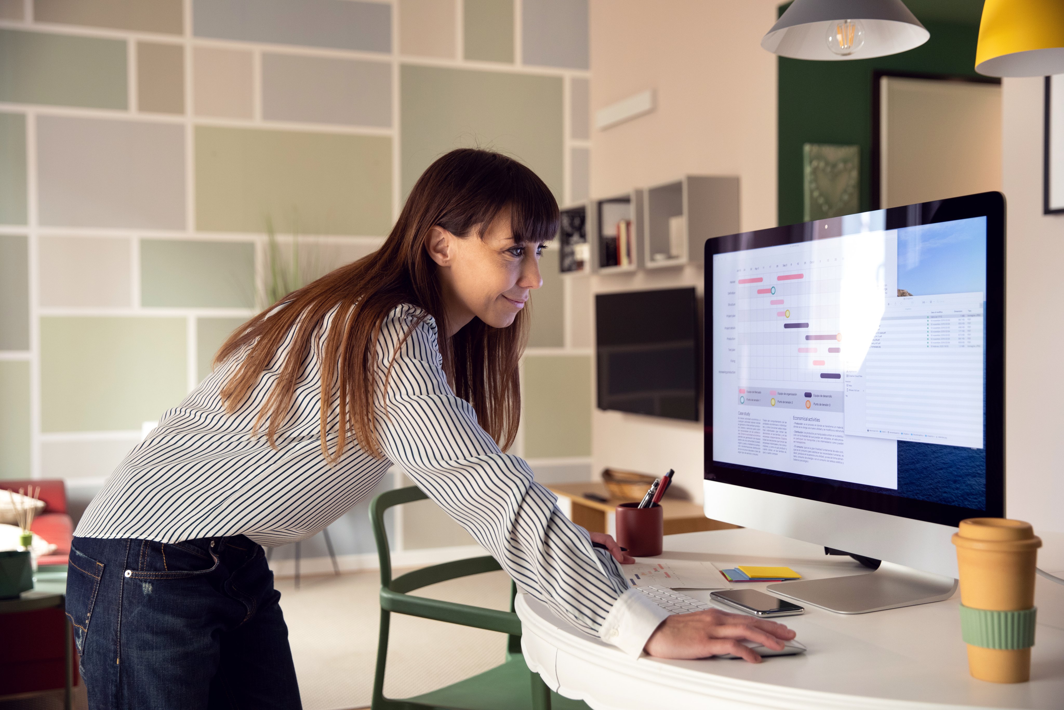 Person reviewing a scheduling and planning dashboard at a bright modern desk