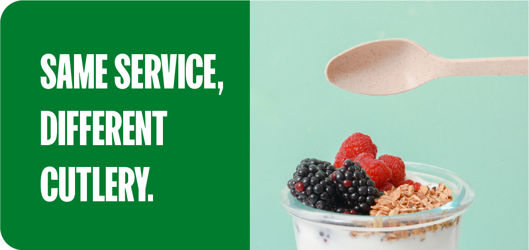 Compostable wood cutlery serving a fresh berry yogurt bowl
