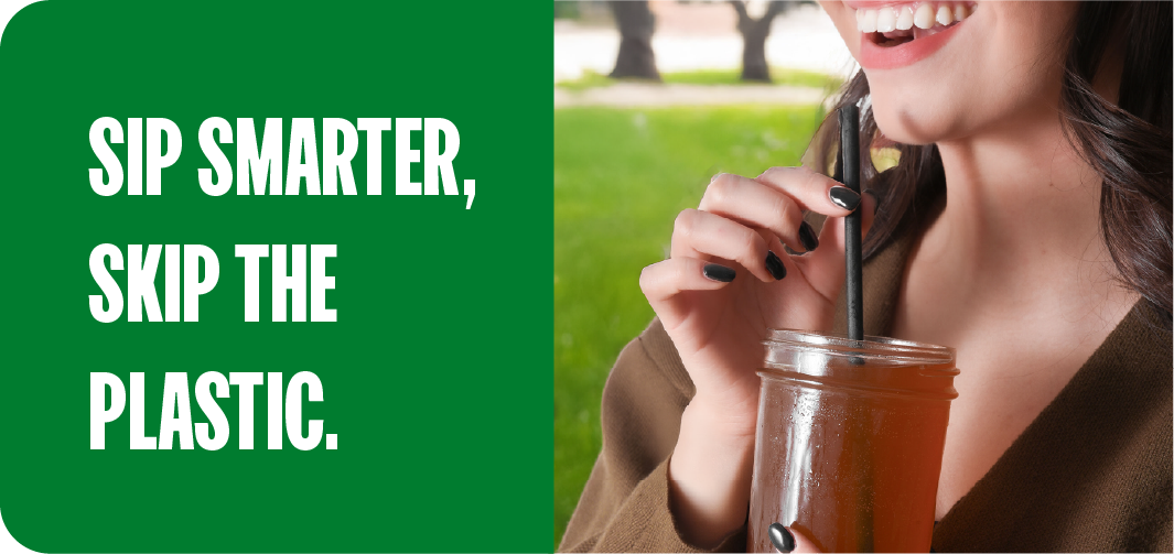 Woman drinking from a reusable glass jar with a metal straw, a simple way to avoid microplastics in water