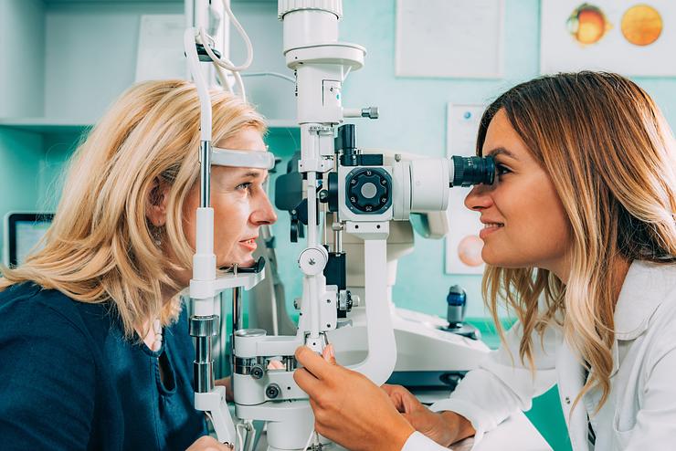 An optometrist conducting eye exam
