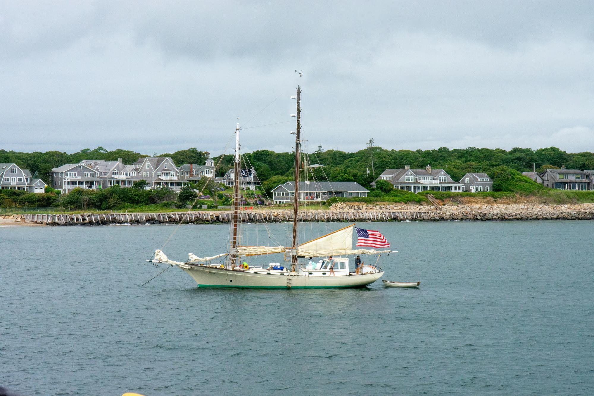 Sailboat anchored off the Martha's Vineyard shoreline in summer