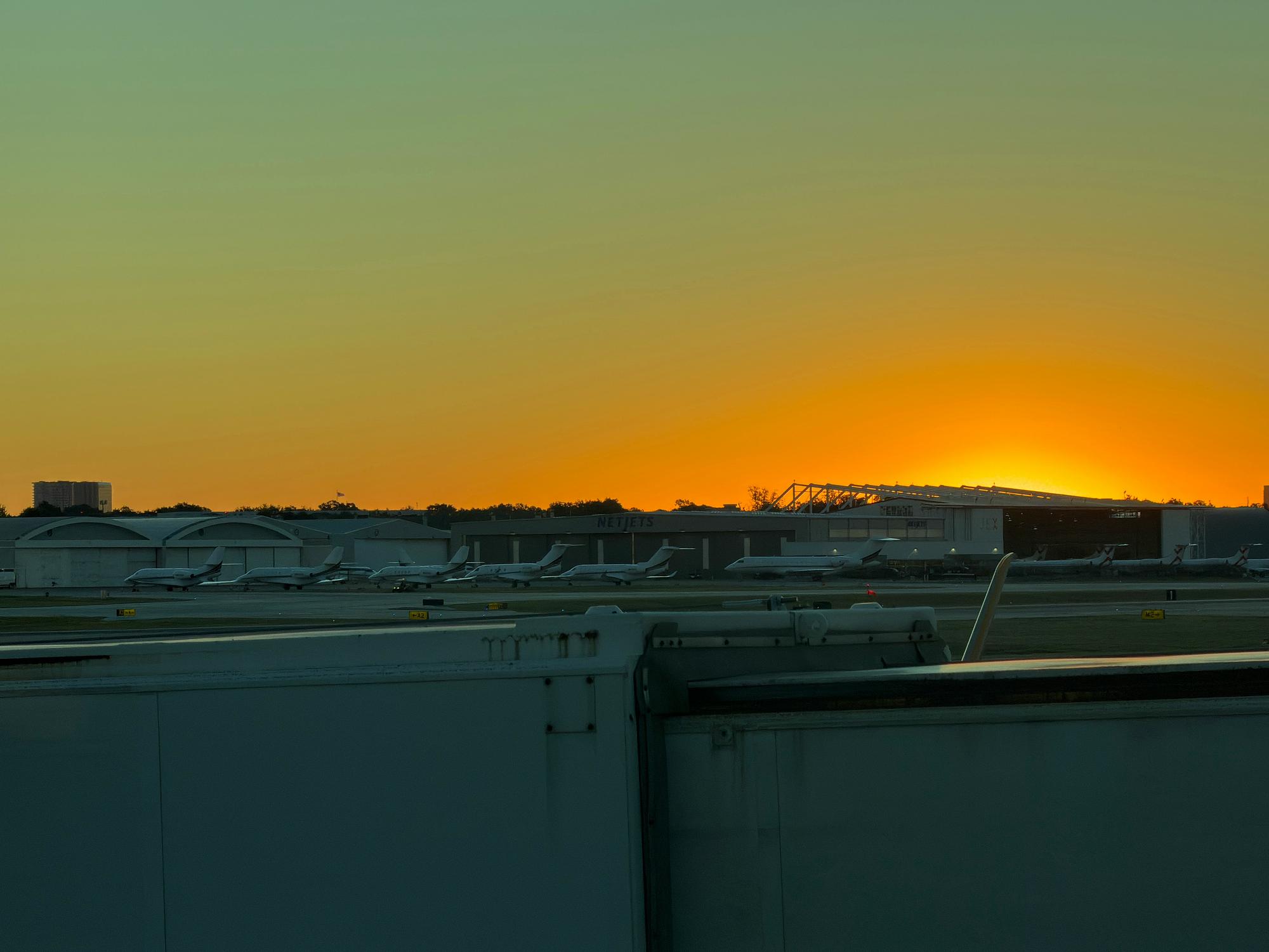 Private jet on the tarmac at sunset before a Van Nuys charter flight