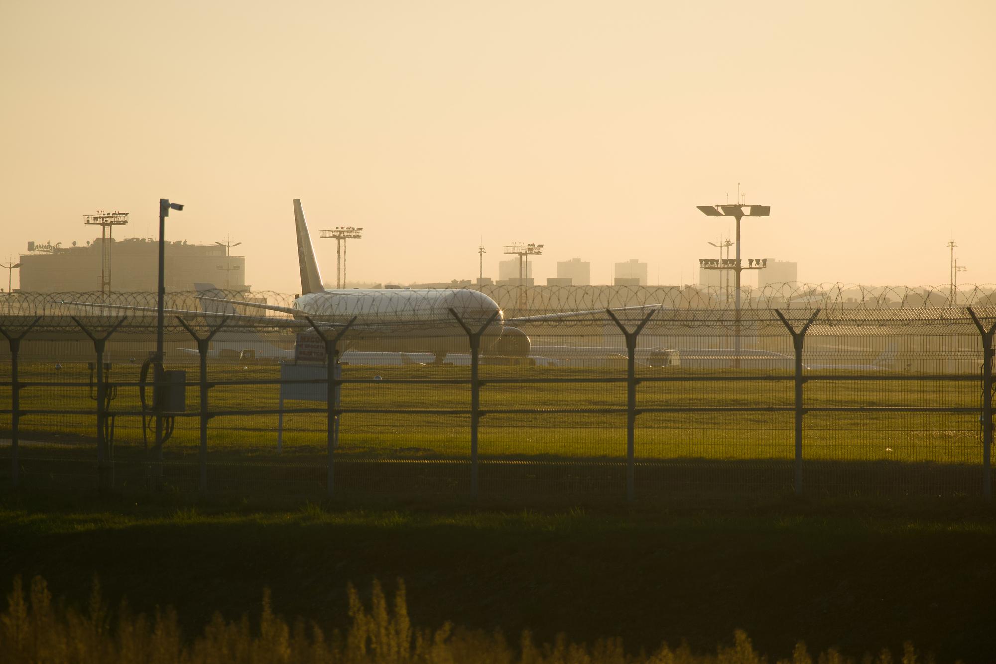High-performance light jet on the ramp at sunset