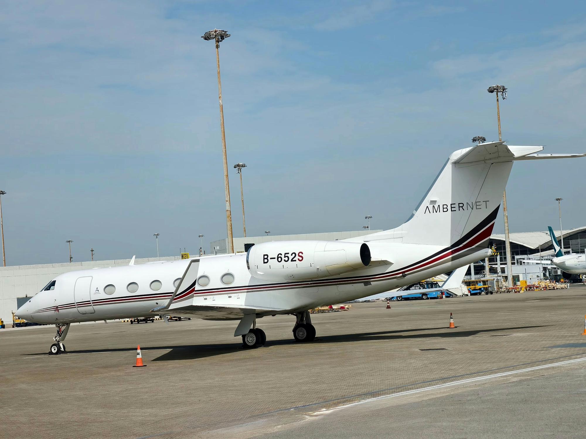 Gulfstream G450 heavy jet parked at a private aviation ramp