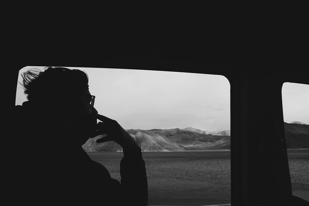 A caller taking a support call from inside a vehicle, the kind of noisy, real-world condition a voice agent must handle.