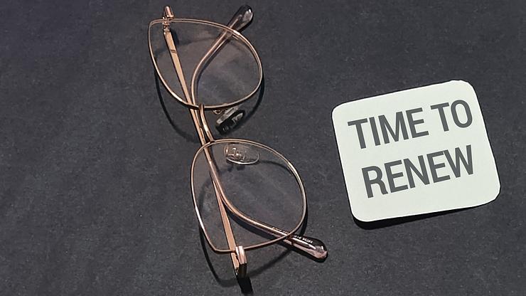 a man trying getting insurance cover on new glasses